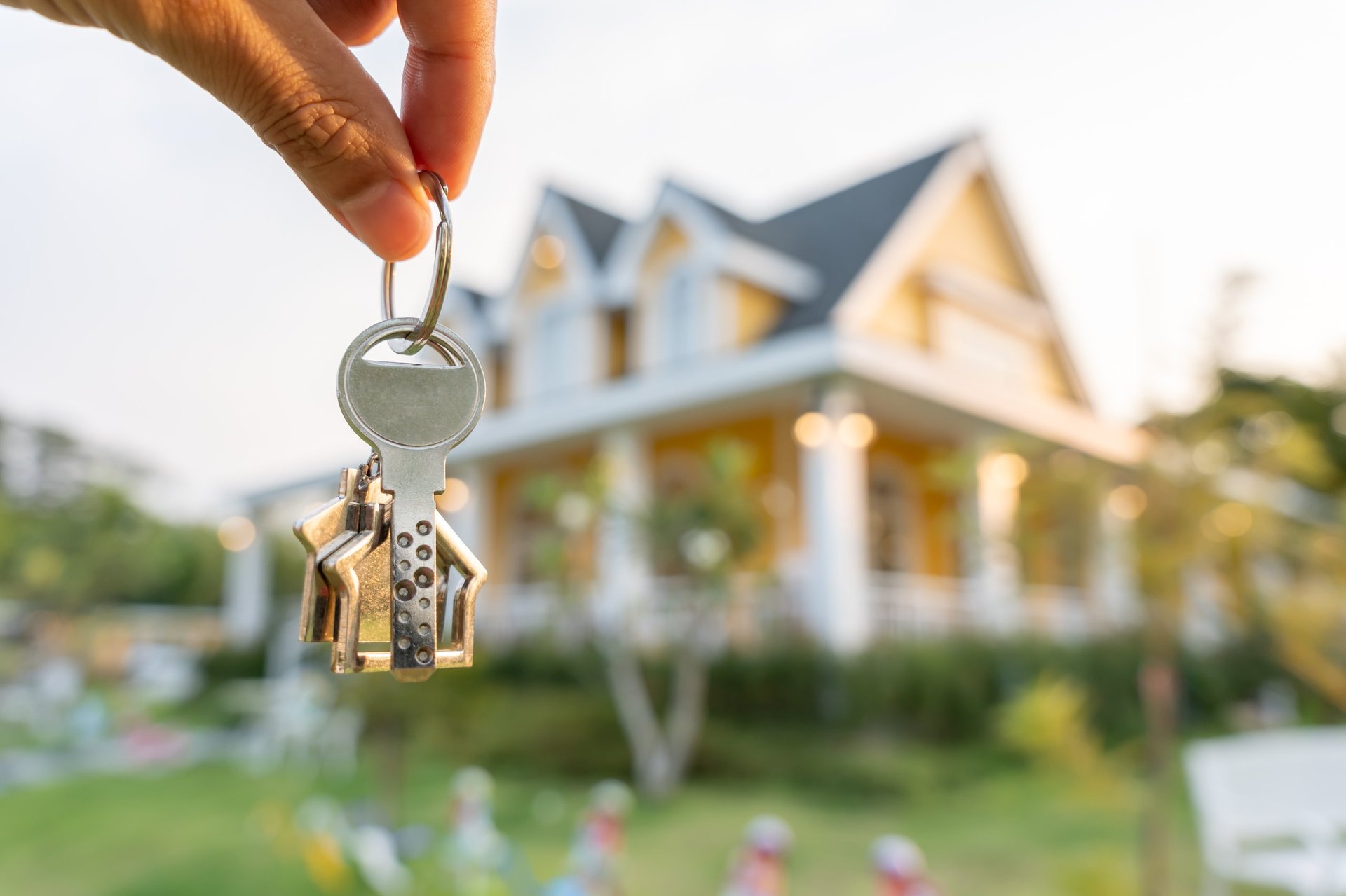 Real estate agent manager smile holding key for new owner