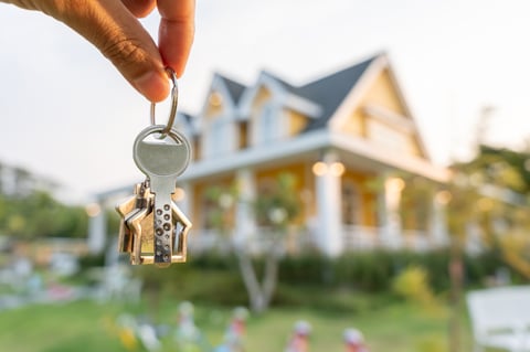 Real estate agent manager smile holding key for new owner