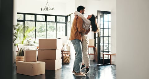 Celebration, hug and couple in new house, moving and ownership of property