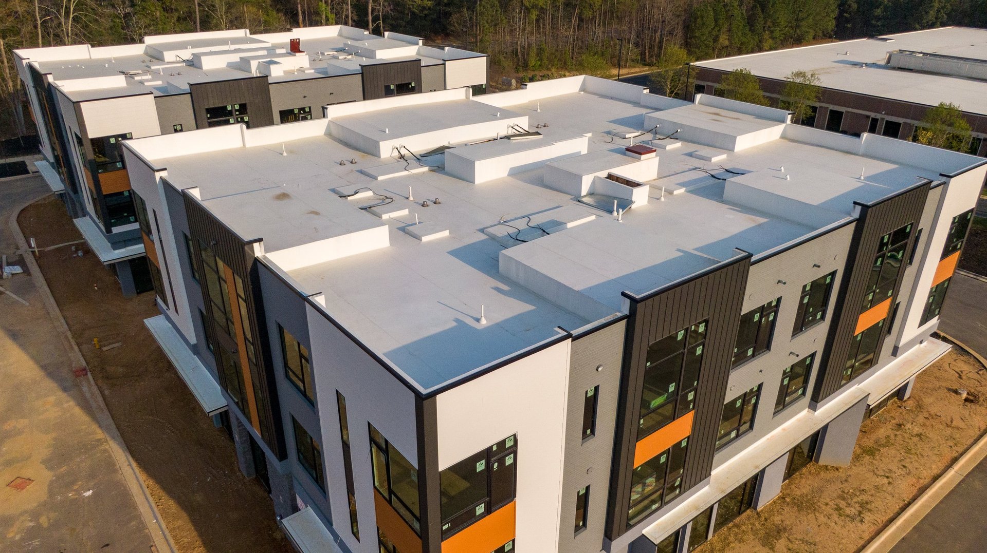 A high-resolution technical drone inspection photo of a commercial TPO roofing system